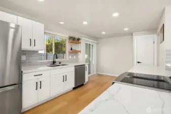 Kitchen with sliding glass door access to backyard.