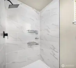 Ensuite with custom tile walk in shower.