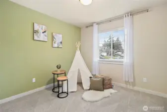Comfortable bedroom with natural lighting.