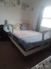 one of three bedrooms