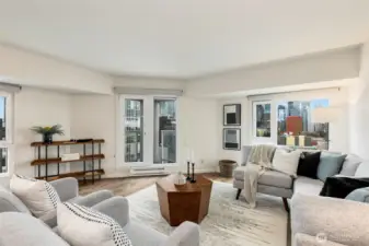 Windows wrap the living room and showcase the iconic Seattle views. Step outside on the corner deck for fresh air enjoyment.