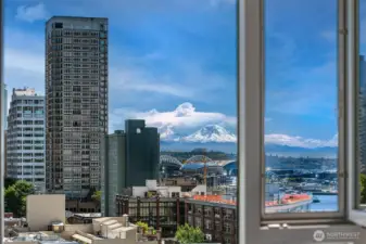 Southwest corner windows showcase the iconic Seattle views. Views of the city skyline, Elliott Bay, and Mt Rainier.