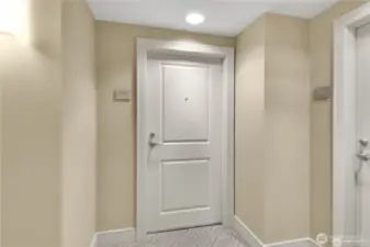 Entry door to Unit 1101 at The Cosmopolitan in Seattle.
