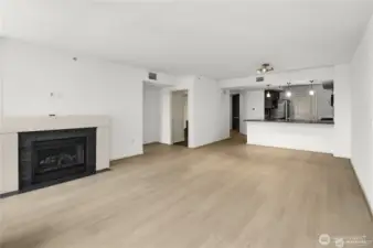 A sleek built-in fireplace adds warmth, style, and a cozy ambiance to the modern space.