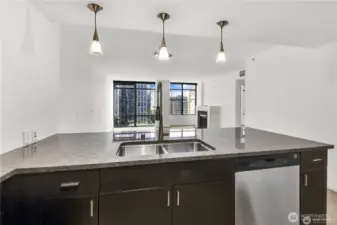 A combination of track and pendant lighting brightens the space.