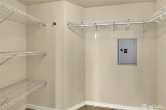 Walk-In Closet: Spacious layout makes organization easy and efficient, with room for both hanging garments and folded storage.
