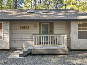 Entry porch with covered entry alcove.