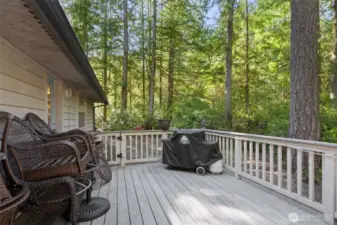 Private fenced deck off dining room also has door from office/craft room