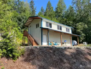 Recently built 2 story garage with covered porch. Perfect for now while you design your new home and for cooking the days catch.