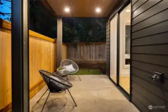 Outdoor patio is fenced for privacy.