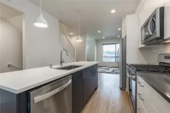 A view of the kitchen, and family room