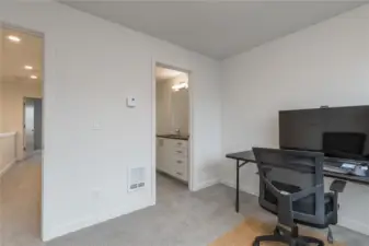 A view of the main bath from the bedroom/office