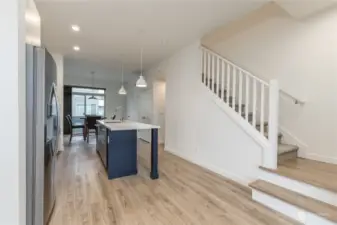 A panoramic view of the kitchen-to-dining room area view