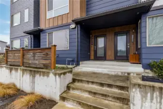 There is a covered shared porch, and a gardening area