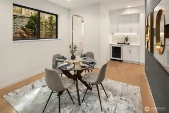 Dining with wet bar and wine fridge for entertaining