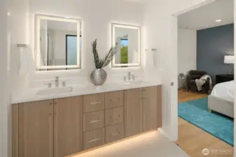 The primary suite boasts wall mounted double vanities with und-lighting, topped with sleek lighted mirrors for a modern spa like experience.