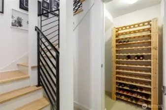 Central staircase, middle floor landing with wine storage or general purpose closet.