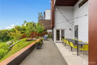 Outdoor dining and BBQ space on the lower level located off of the family room.