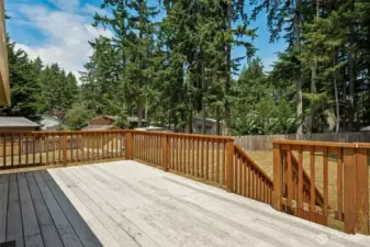 spacious deck overlooks the yard.
