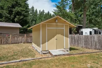 Large storage shed with 2 separate sides.