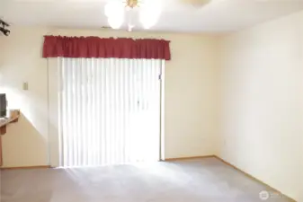 Family room with a slider to the back patio.