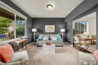 First living space, right off the entry. On the left are large windows, over looking the front yard. On the Right is an entrance to the formal dining room.