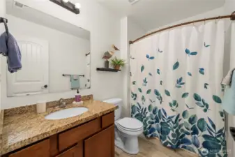The hall bathroom upstairs is complete with a shower/tub combo unit.