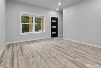 Front door entering living room. This description captures the view from the entrance, highlighting the transition from the exterior to the main living area of the property.