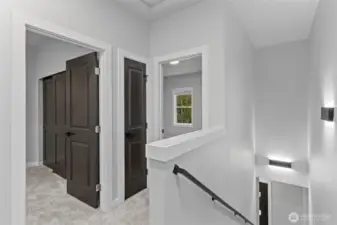 Stairs with a view of the other rooms; featuring modern lighting.