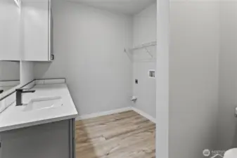 Utility room with 2/5 bath, builder is providing new GE washer and dryer