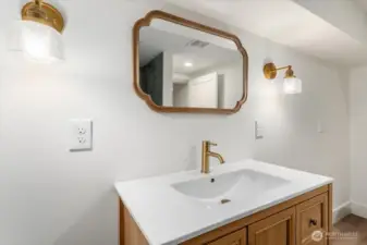 Just off the basement room is a fully updated, beautifully designed full bathroom.