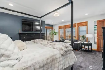 Primary bedroom enjoys the view & access to the large deck.
