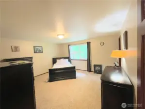 Large Primary Bedroom with a walk in closet.