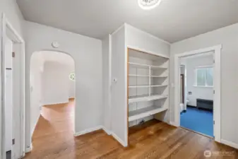 The bedroom hallways is accessible from the kitchen and living room area.