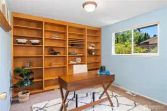 Bedroom #2 with massive, custom ad beautiful built in bookshelf.
