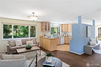 Behind the blue wall is an kitchen appliance garage to house your blender/mixer/toaster. This thoughtful design allows for socializing while cooking.