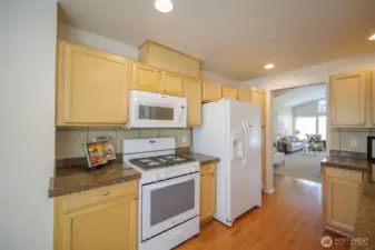 Granite tile counters and gas cooking for the chef.