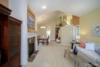 The vaulted stairwell features a display shelf.
