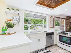 Beautiful, bright open kitchen has a garden window a perfect spot for plants and herbs.