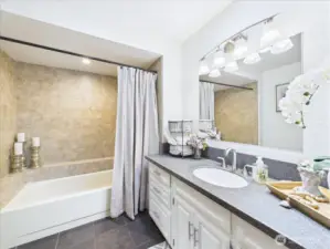 Airy and bright hall bathroom.