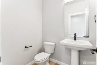 Main level half bath. Images of previously completed home.