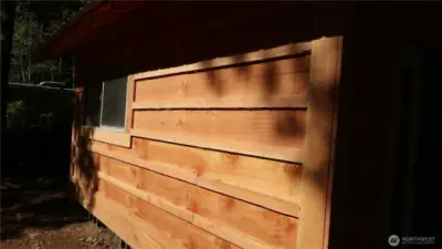 Side of shed with window to look out and see all the fish.