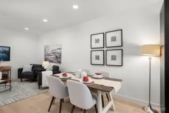 Gather and connect in the inviting dining area, where natural light and thoughtful design meet. This space complements the heart of the home beautifully. Photos of home with similar layout, finishes & fixtures.