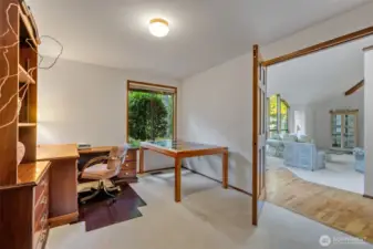 Another view of the office shows its connection to the entry hallway and living room