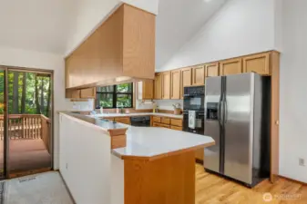 The galley kitchen has plenty of cupboard space and looks onto the large back yard
