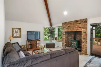 The TV room right off the kitchen and next to the deck