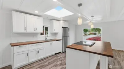 New kitchen with Butcher Block counters and large skylight