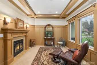 Sitting room in primary suite with gas fireplace