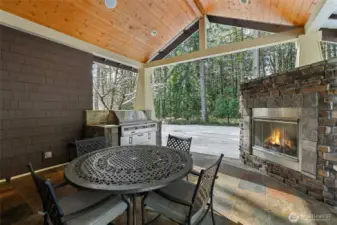 Covered patio off the kitchen with built-in grill and fireplace