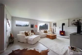 Large, bright living room with new gas heat stove